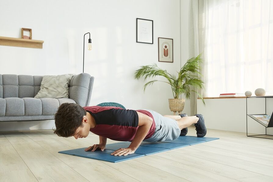 Stand on a plank to work the press and spinal muscles